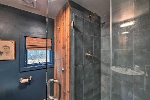 a bathroom with a shower and a sink at Cozy Woodstock Home with Fire Pit! in Woodstock