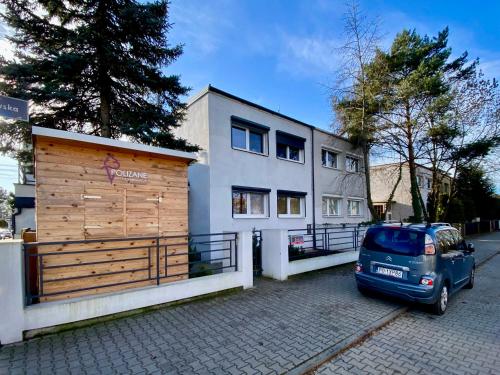a car parked in front of a house at Yose Apartment - 160 m2 na wyłączność in Poznań