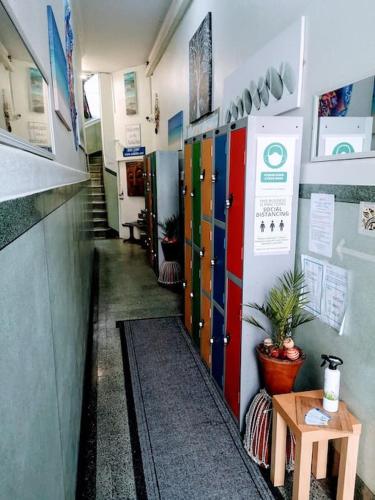 a hallway of a room with colorful doors and a table at aabAlree Guest House in Dundee