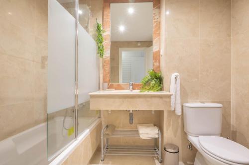 a bathroom with a sink and a toilet and a shower at Sunrise Golf Paradise 1 - Mijas Golf Spain in Mijas