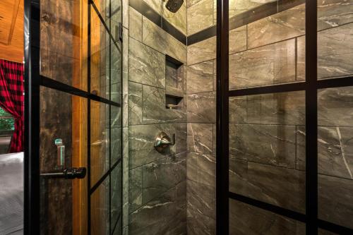 a door to a shower in a room at Dreamy Cabin & Outdoor Oasis! Mins to Nat'l Park! in Townsend