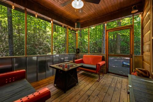 a screened in porch of a tree house at Dreamy Cabin & Outdoor Oasis! Mins to Nat'l Park! in Townsend