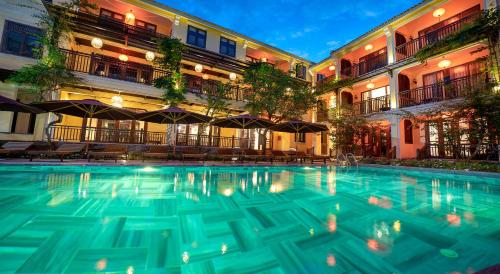 a swimming pool in the middle of a building at Ahoy Hoi An Boutique Resort & Spa in Hoi An