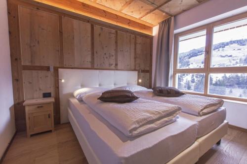 Postel nebo postele na pokoji v ubytování Appartamenti Residence Pars