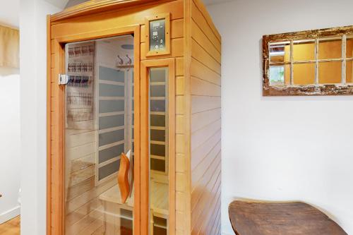 a wooden elevator in a room with a chair at Newfane Hill Retreat in Newfane