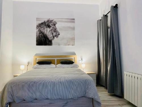 a bedroom with a bed with a picture of a horse at COSTASOL PLAZA - PREMIUM CLASS - Apartamento céntrico moderno - 3BED 2ROOM 6PEOPLE - in Córdoba