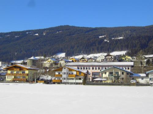 a group of houses on the shore of a lake at Appartement Pichler in Radstadt