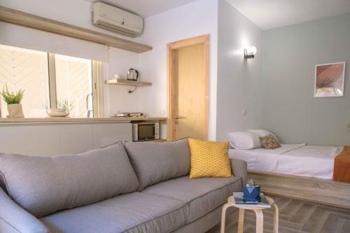 a living room with a couch and a bed at BIRD NEST Near Arkan Plaza in Cairo