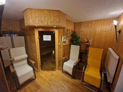 a room with two chairs and a table and a door at Inselhotel Kapitän Tadsen / Amrum in Nebel