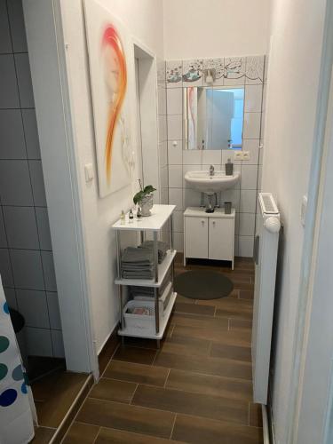a bathroom with a sink and a mirror at Top-Apartment in Mürzzuschlag