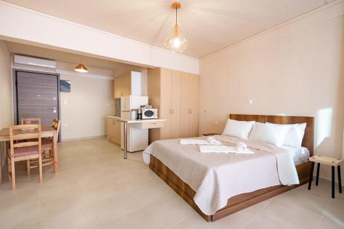 a hotel room with a bed and a table at Monastiraki metro station studio for 4 persons in Athens