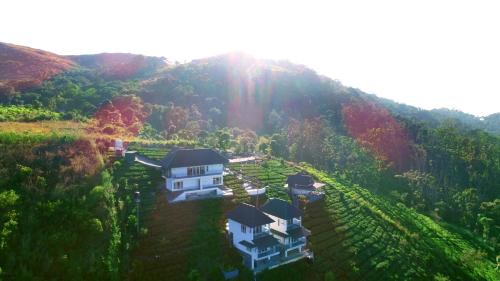 an aerial view of a house on a hill at 10 Degrees North By Avni Holidays in Idukki