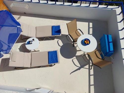 an overhead view of a patio with a table and chairs at Hotel Agia Roumeli by the SEA in Agia Roumeli