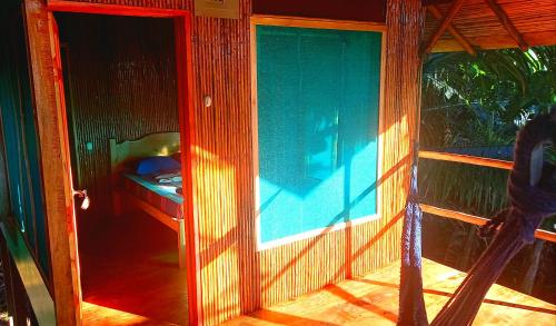 a glass door to a room with a swimming pool at Encanto Lodge in Drake