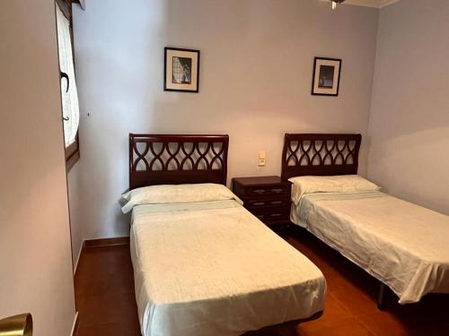 Posteľ alebo postele v izbe v ubytovaní Apartamento Edificio Cunchas
