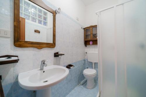 a bathroom with a sink and a toilet at Dimora Capoliveri in Capoliveri