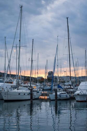 a group of boats docked in a marina at sunset at Villa Lida Apartment, in collina con ampio terrazzo e vista mare in Giulianova
