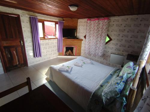 Cama o camas de una habitación en Pousada Da Santina