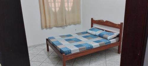 Ένα ή περισσότερα κρεβάτια σε δωμάτιο στο Apartamento em Cabo Frio com Wi-fi