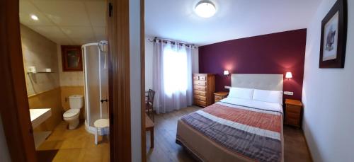 Postel nebo postele na pokoji v ubytování Hotel Casa Escolano