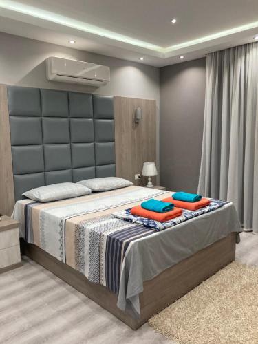 a bedroom with a bed with two pillows on it at Modern apartment in Sharm El Sheikh