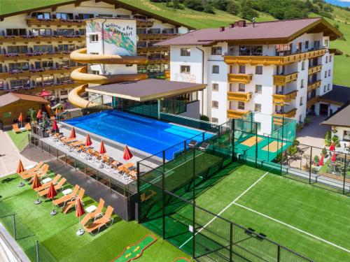 an aerial view of a hotel with a swimming pool at Alpenhof in Gerlos