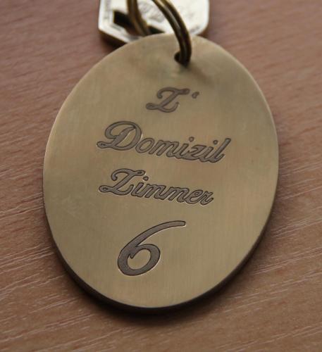 a medal with the name of a dauntlessainer on a table at Haus am Rain in Partenen