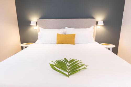 Postel nebo postele na pokoji v ubytování Eden Roc Appartements