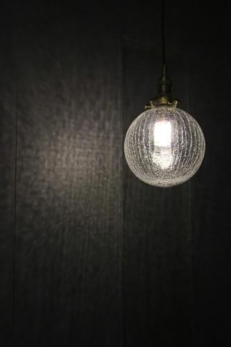 a light hanging from a ceiling in a room at 161 Easy Inn in Yuchi