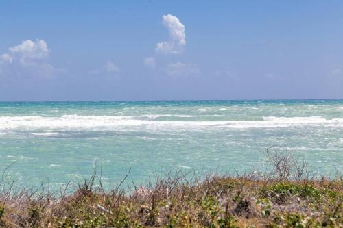 a view of the ocean from a beach at Hellshire Portmore Vacation Home in Portmore