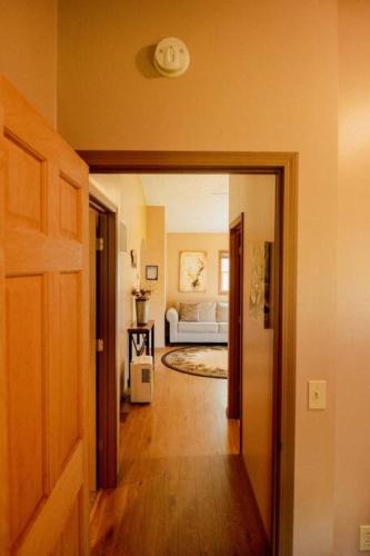 a hallway leading to a bedroom with a bed at Maple Creek Cabin, minutes from Cook Forest, ANF in Marienville