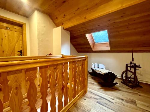 a room with a wooden railing and a window at Hotel ŠURC in Kranjska Gora