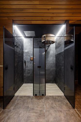 a glass elevator in a building with a ceiling at Korona Hotel&SPA in Bukovel
