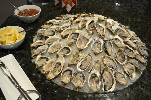 a bunch of oysters on top of a table at Hotel Time Boutique Nilai in Nilai