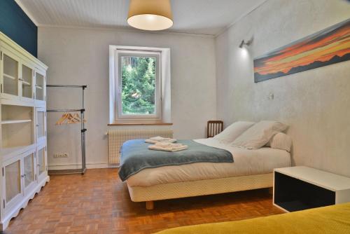 Ένα ή περισσότερα κρεβάτια σε δωμάτιο στο Appartement 6 pers 70 m² dans chalet Chez Marie