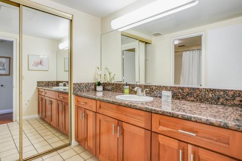 a bathroom with a sink and a mirror at Hanalei Bay Resort 2302 in Princeville