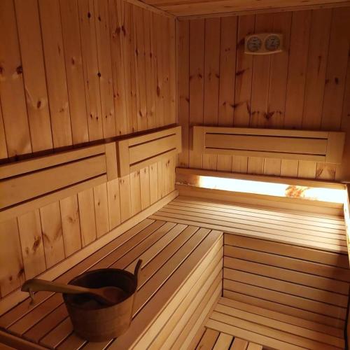 a inside of a sauna with a bucket in it at Vila MP Banstol 4*- Brdež do, Fruška gora in Inđija