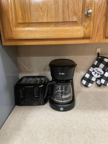 a coffee maker sitting on a counter in a kitchen at Quiet Private House w Hot Tub/Fire pit/Games in Blakeslee
