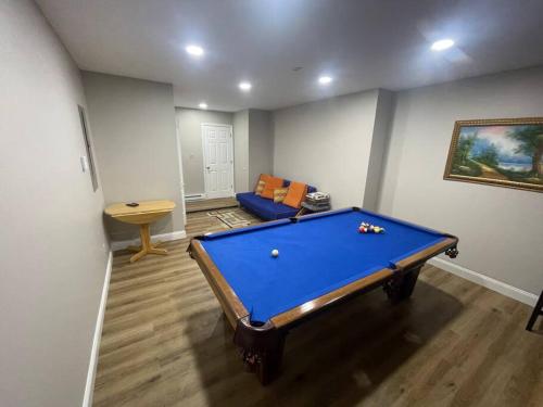 a living room with a pool table in it at Quiet Private House w Hot Tub/Fire pit/Games in Blakeslee