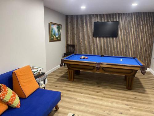 a living room with a pool table and a tv at Quiet Private House w Hot Tub/Fire pit/Games in Blakeslee