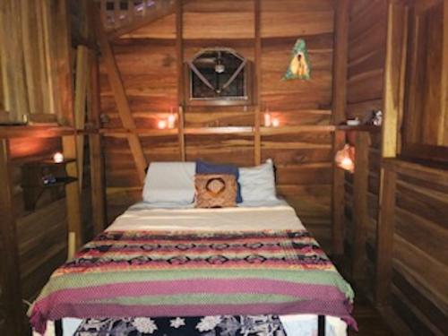 a bedroom with a bed with a teddy bear on it at Casonita in Manzanillo