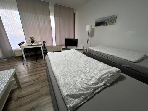 Ένα ή περισσότερα κρεβάτια σε δωμάτιο στο Wohnung in Troisdorf