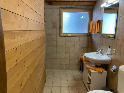 a bathroom with a sink and a toilet at Ferienhaus Ferwall in Sankt Anton am Arlberg
