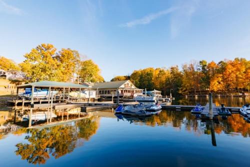 a group of boats docked at a marina at Halesford Harbour Resort - Smith Mountain Lake in Moneta