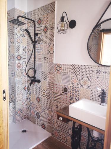 a bathroom with a sink and a shower at Casa Rural El Llano Quintanilla in Yecla