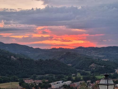 a sunset over a city with a street light at Podere Vecci in Dicomano