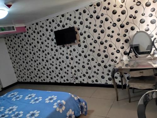 a room with a mirror and a table with a hair salon at Festival mall apartments in Lagos