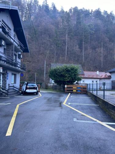 a parking lot with a car parked next to a building at Sobe “Stari Grad-Samobor” in Samobor