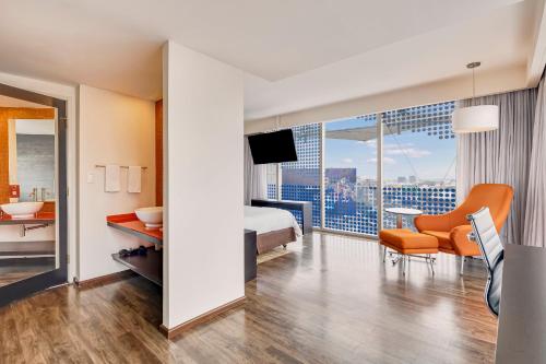 a hotel room with a bed and a balcony at Fiesta Inn Insurgentes Viaducto in Mexico City