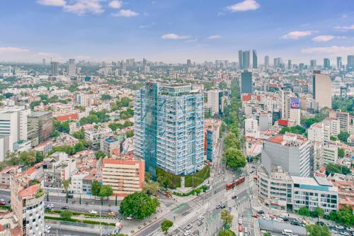 an aerial view of a city with tall buildings at Fiesta Inn Insurgentes Viaducto in Mexico City